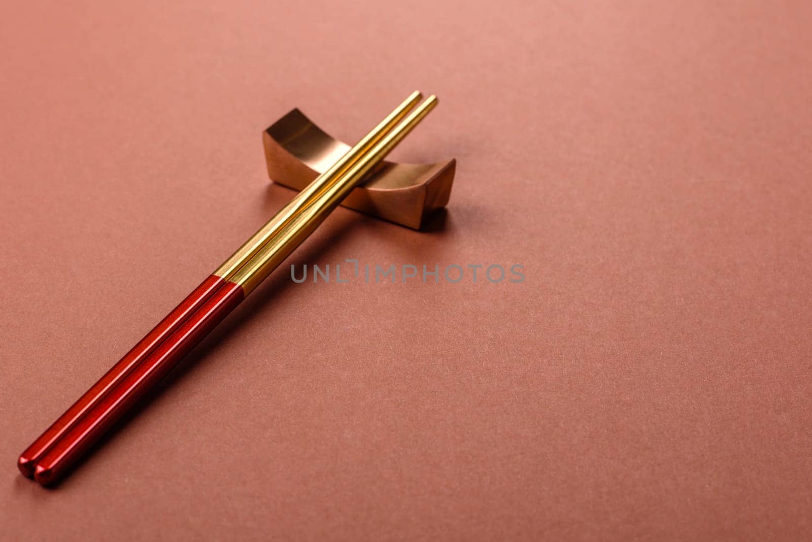 Chopsticks for sushi or other Japanese or Chinese food on a brownstone table. Asian chopsticks