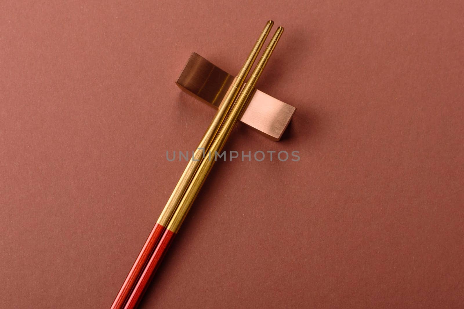 Chopsticks for sushi or other Japanese or Chinese food on a brownstone table. Asian chopsticks