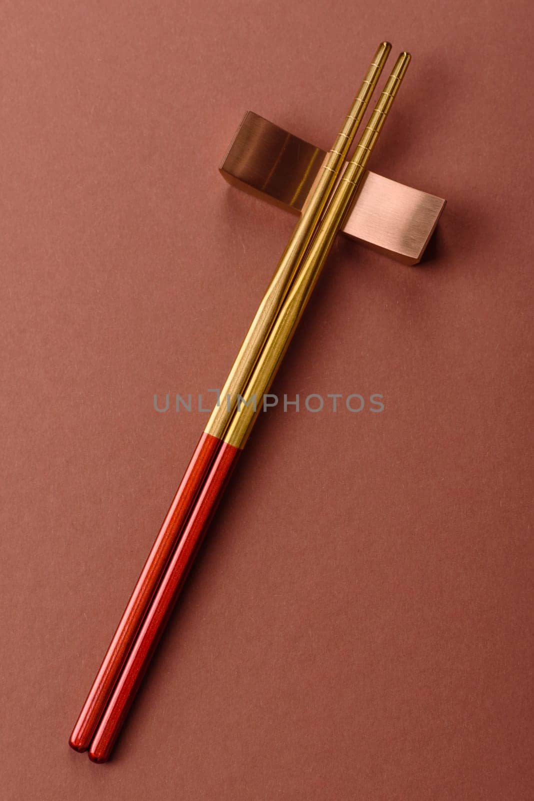 Chopsticks for sushi or other Japanese or Chinese food on a brownstone table. Asian chopsticks