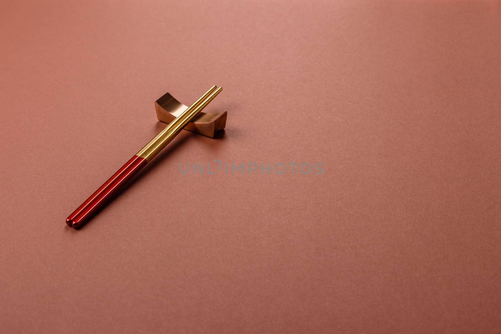 Chopsticks for sushi or other Japanese or Chinese food on a brownstone table. Asian chopsticks