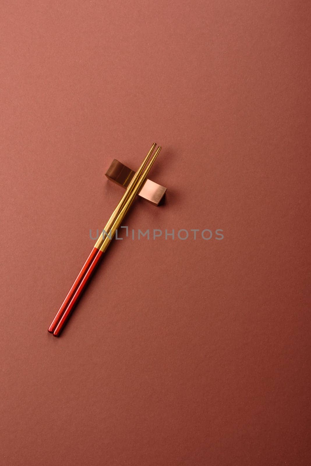 Chopsticks for sushi or other Japanese or Chinese food on a brownstone table. Asian chopsticks