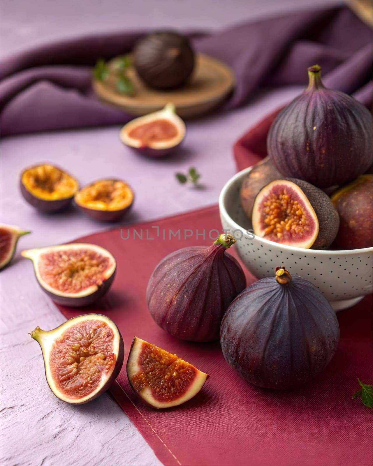 A close-up of fresh figs, both whole and sliced, showcasing their vibrant purple skin and rich, sweet interior. Perfect for showcasing seasonal fruit, healthy snacks, and gourmet food photography.
