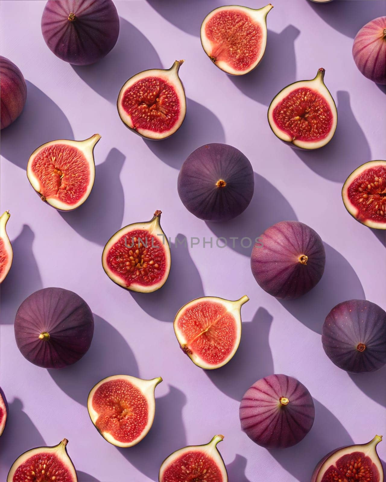 A symmetrical and visually striking geometric arrangement of fresh fig halves, showcasing the vibrant red seeds on a soft purple background.