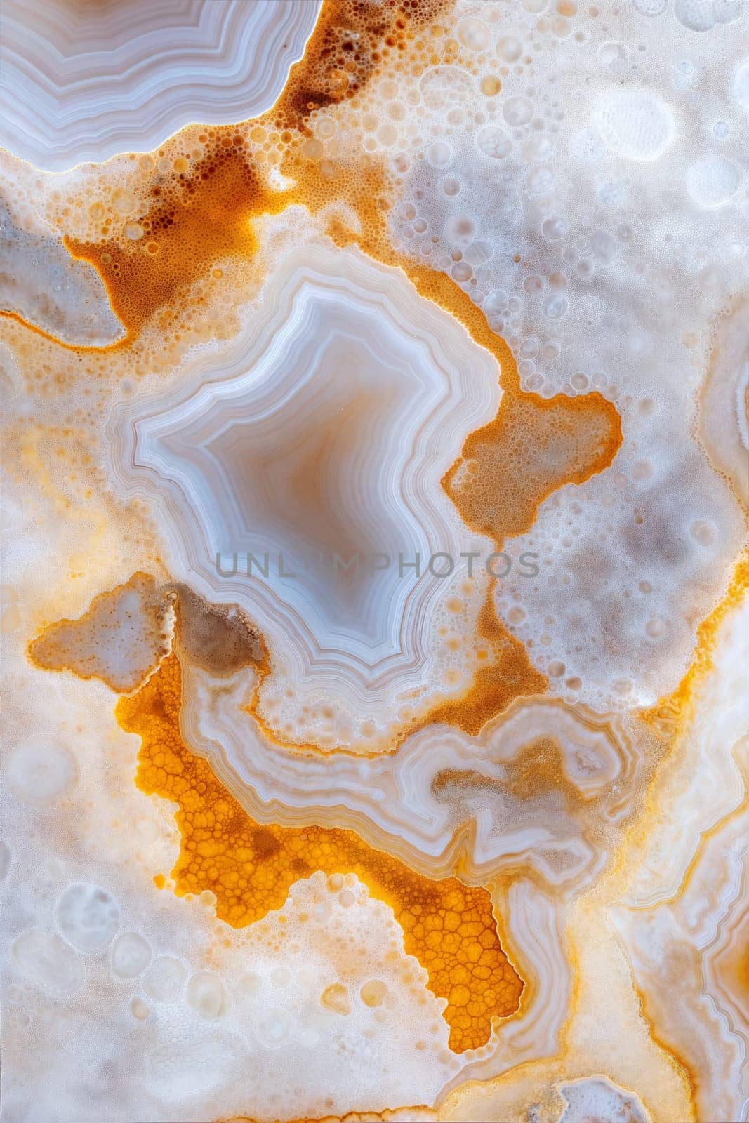 A close-up of beautiful agate with stunning golden and white stripes. The intricate patterns and natural colors make it perfect for backgrounds, design, and artistic projects.