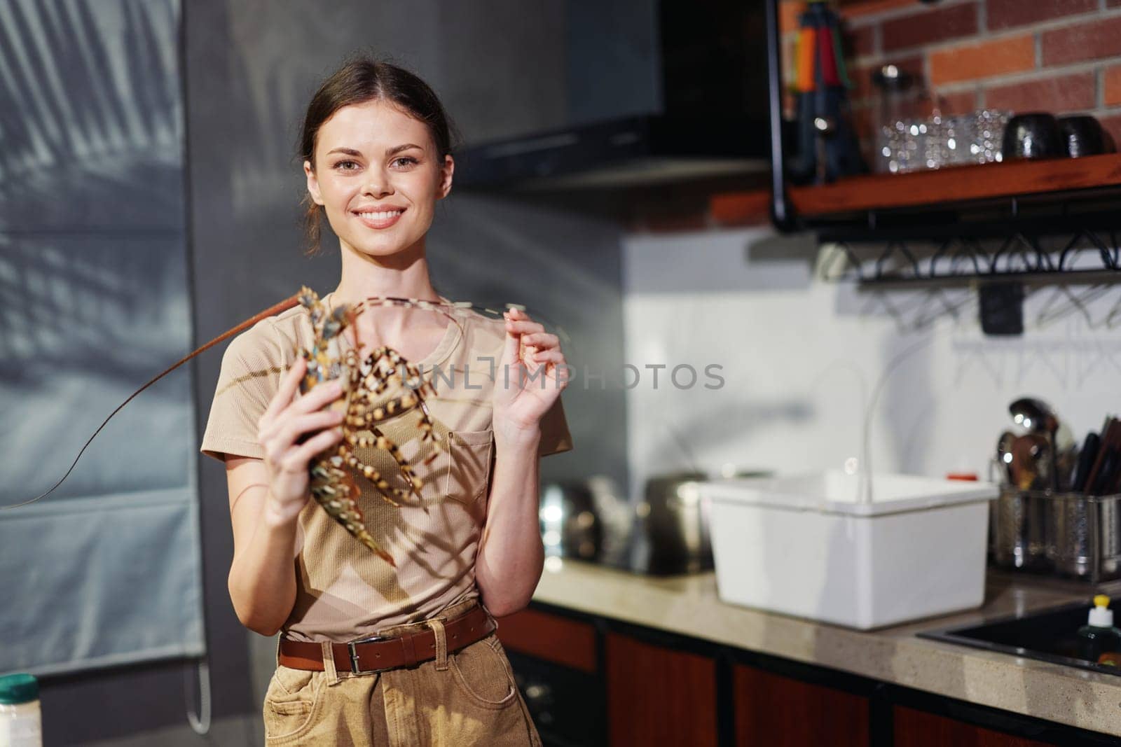 Healthy lifestyle concept Woman holding up fresh fruit in modern kitchen setting
