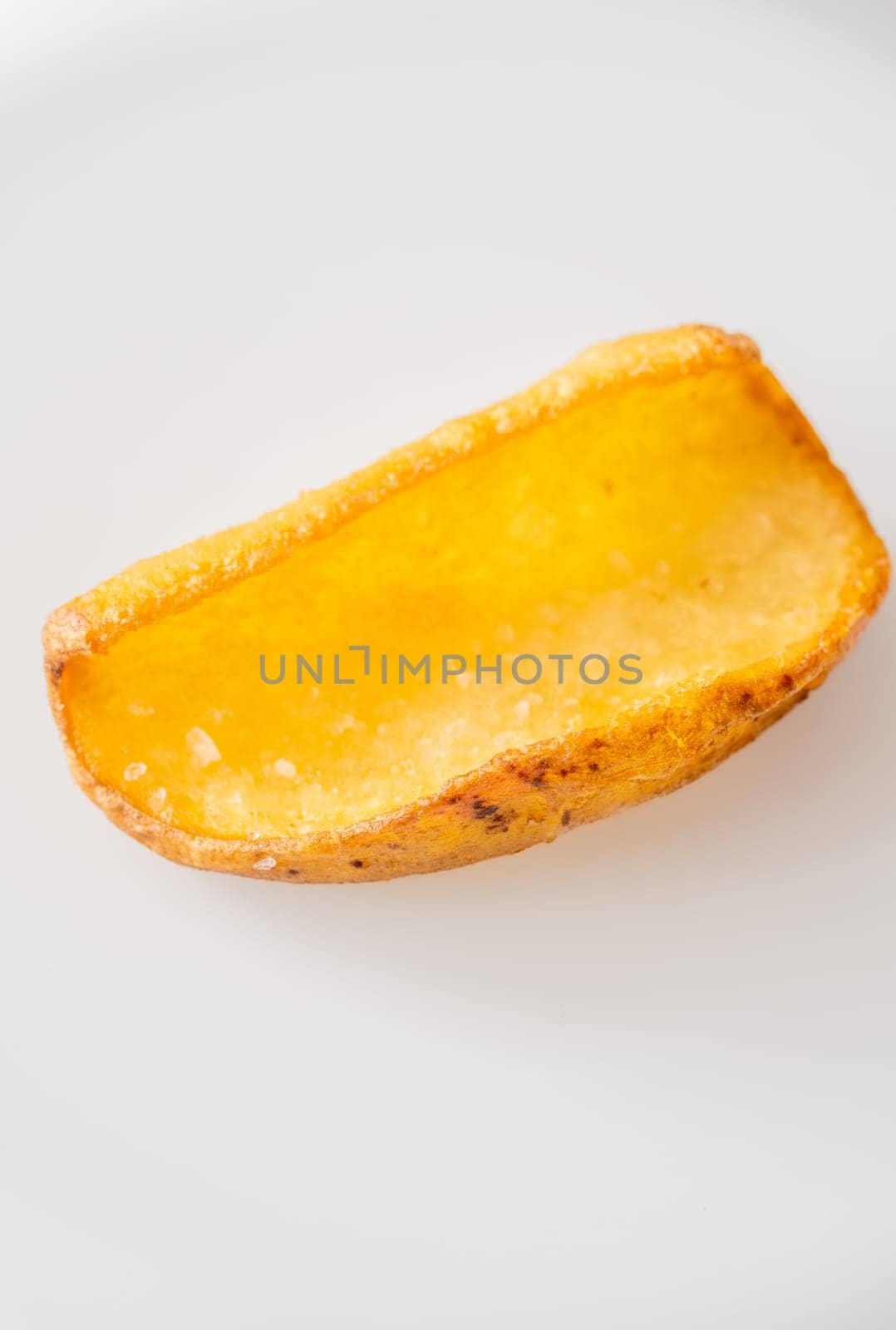 Golden dipper rests alone in focus, edges crisp and texture richly detailed