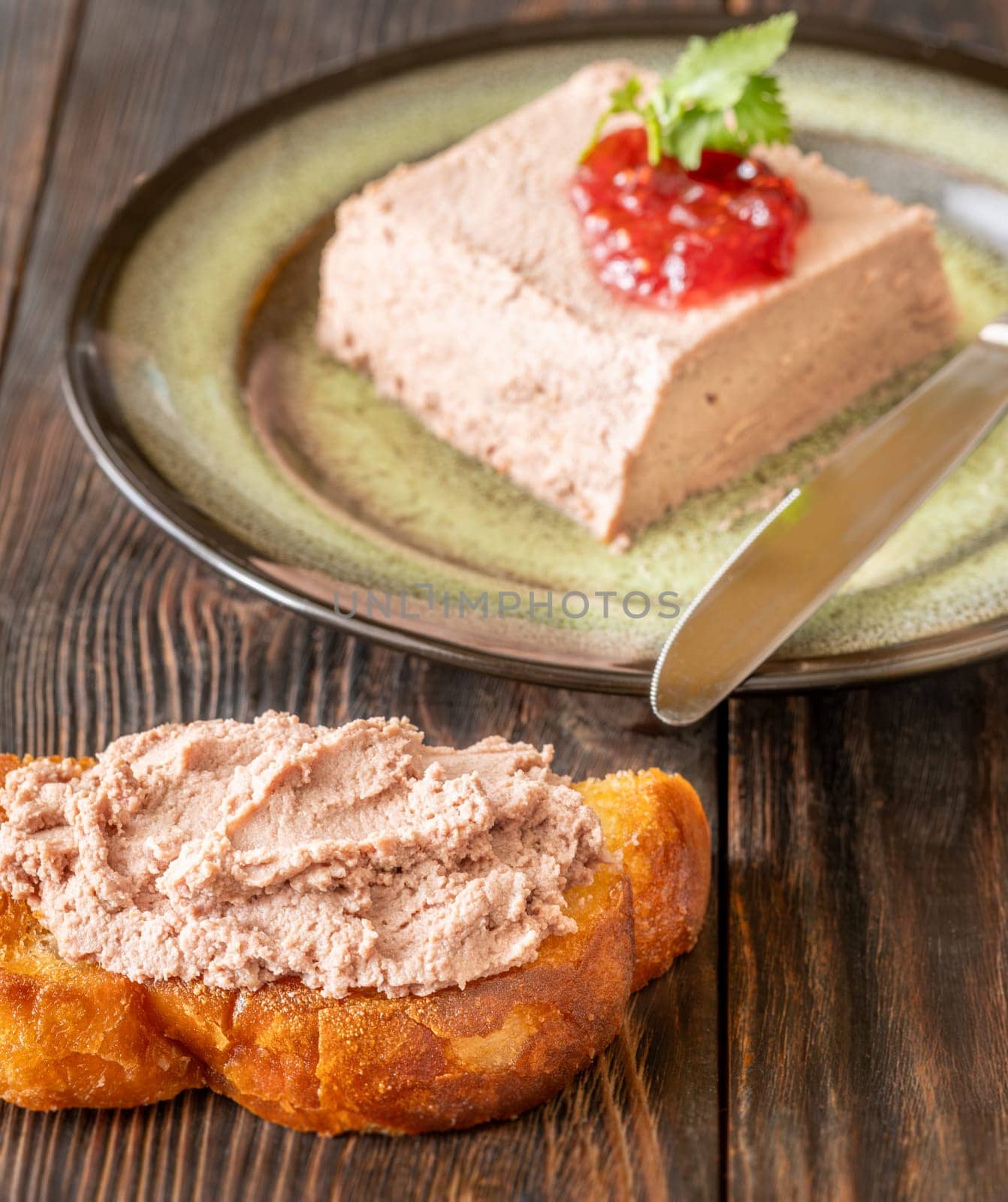 Lush pate paired with tart jam, crispy toast, and briny pickled vegetables