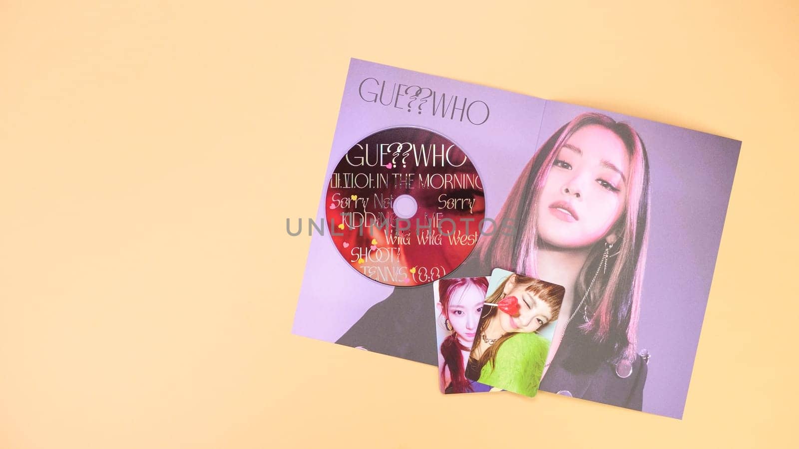 Gatineau, QC Canada - 03.16.2024: K-pop group Itzy Guess Who music Album on yellow background. Special edition music CD. South Korean girl group Itzy