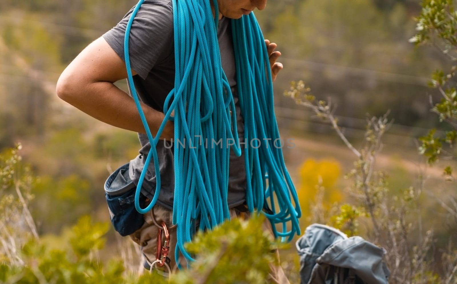Man with a rope climbing in the mountains. Climbing in the mountains of Spain. Technical mountaineering.