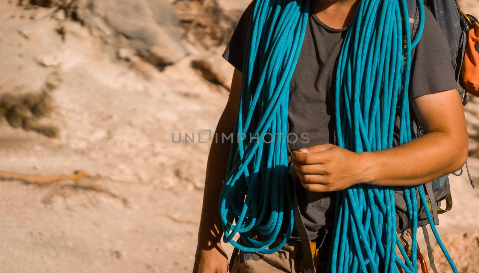 Man with a rope climbing in the mountains. Climbing in the mountains of Spain. Technical mountaineering.