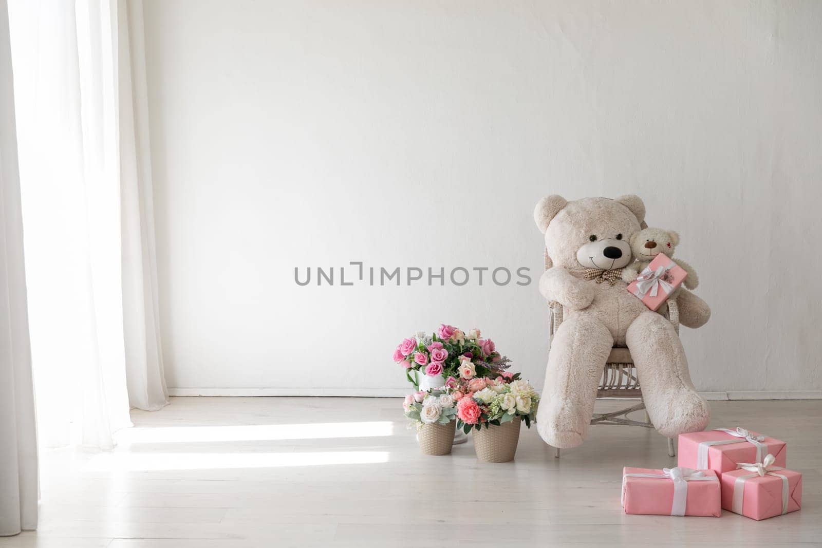Polar bear toy flower baskets and gifts in the interior of a white room