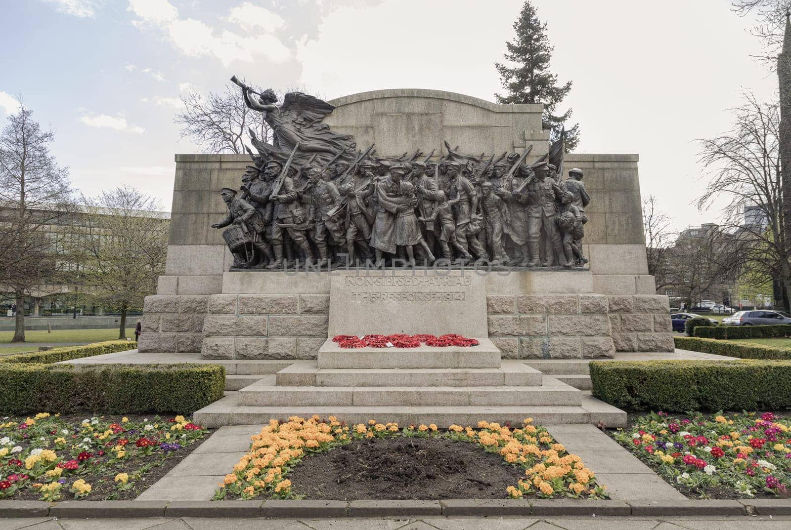 Newcastle, UK - Apr 14, 2025 - 'The Response 1914' is A war memorial to the Northumberland Fusiliers in the public gardens to the north of the Church of St Thomas the Martyr in Barras Bridge, Newcastle upon Tyne. use it as your Wallpaper, Poster and Space for text, Selective focus.