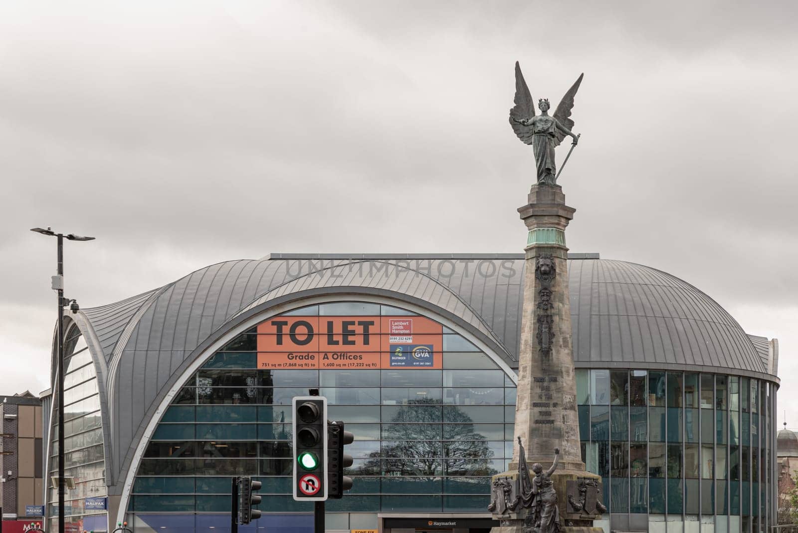 Newcastle, UK - Apr 14, 2025 - The South African War memorial with the Haymarket in the background. use it as your Wallpaper, Poster and Space for text, Selective focus.