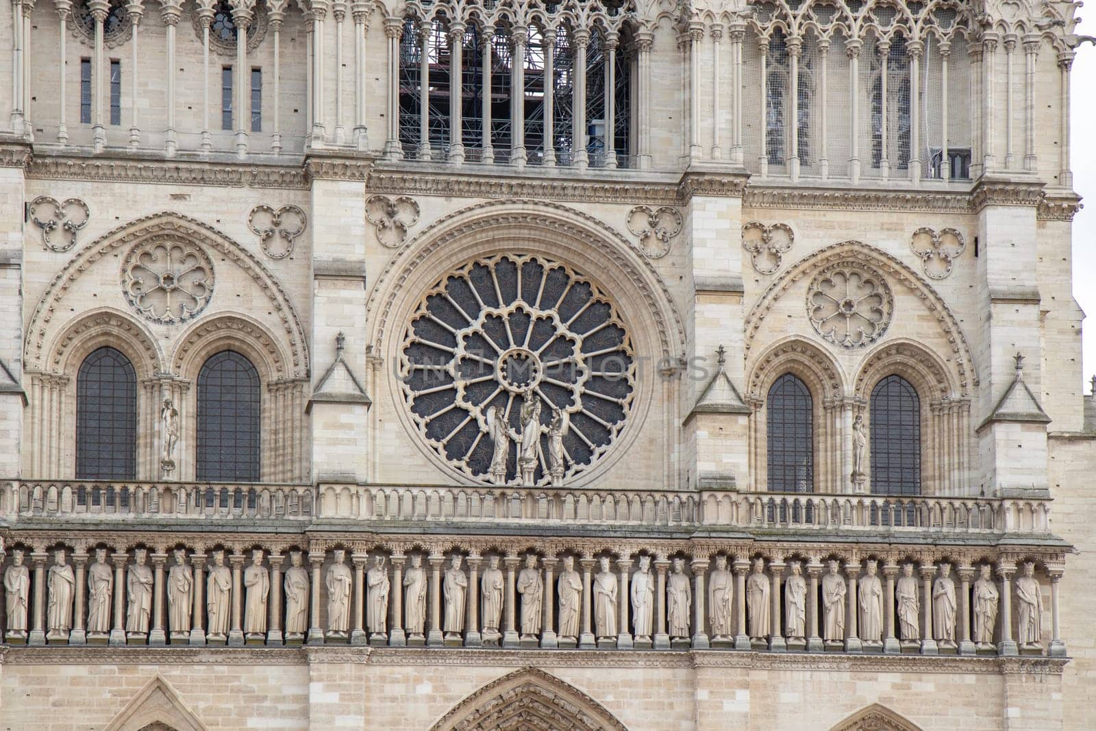 Paris, France - February 22nd 2025 : visitors in The Notre-Dame de Paris, newly re-opened cathedral restored after reconstruction, details of exterior