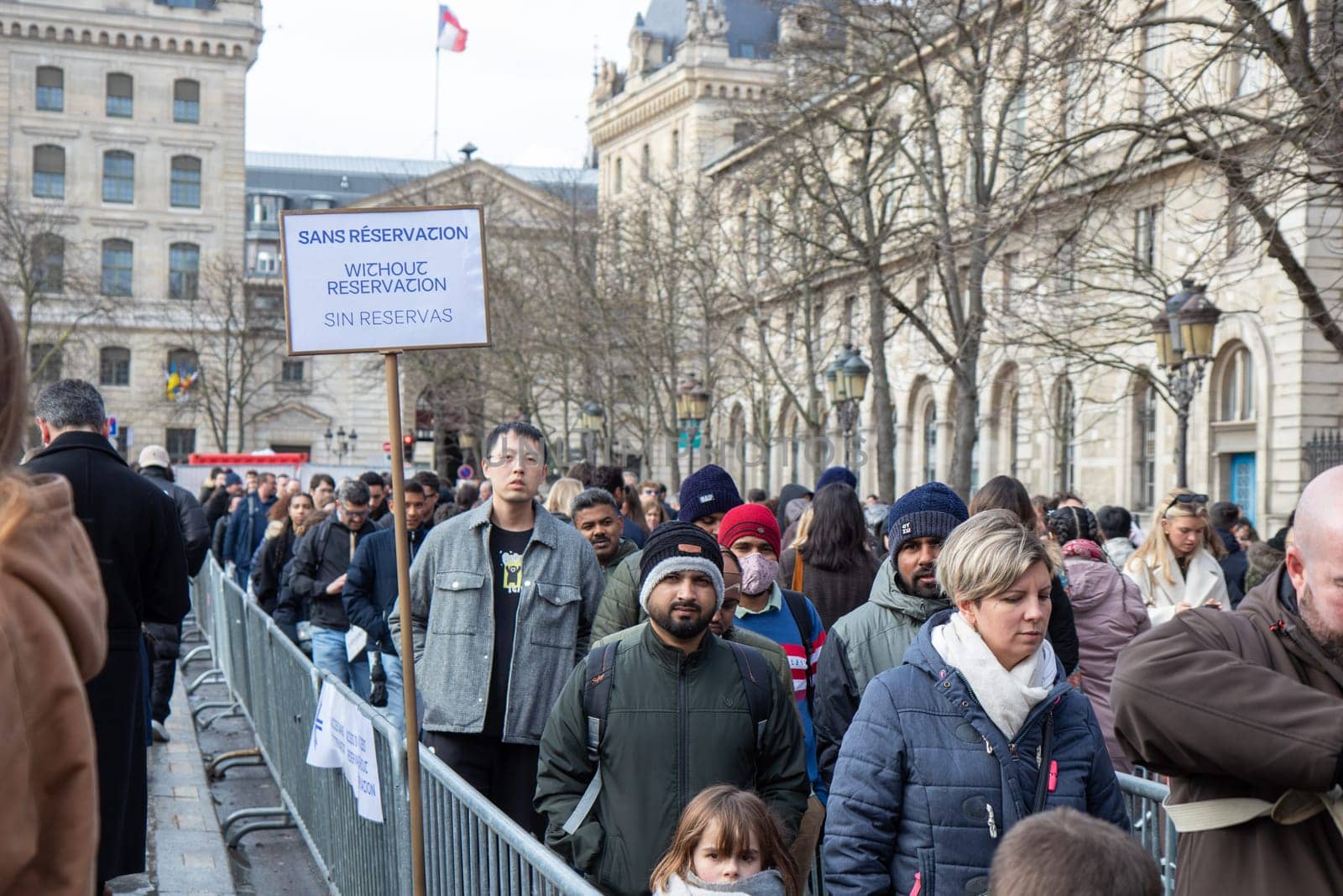 Paris, France - February 22nd 2025 : visitors in The Notre-Dame de Paris, newly re-opened cathedral restored after reconstruction, details of exterior