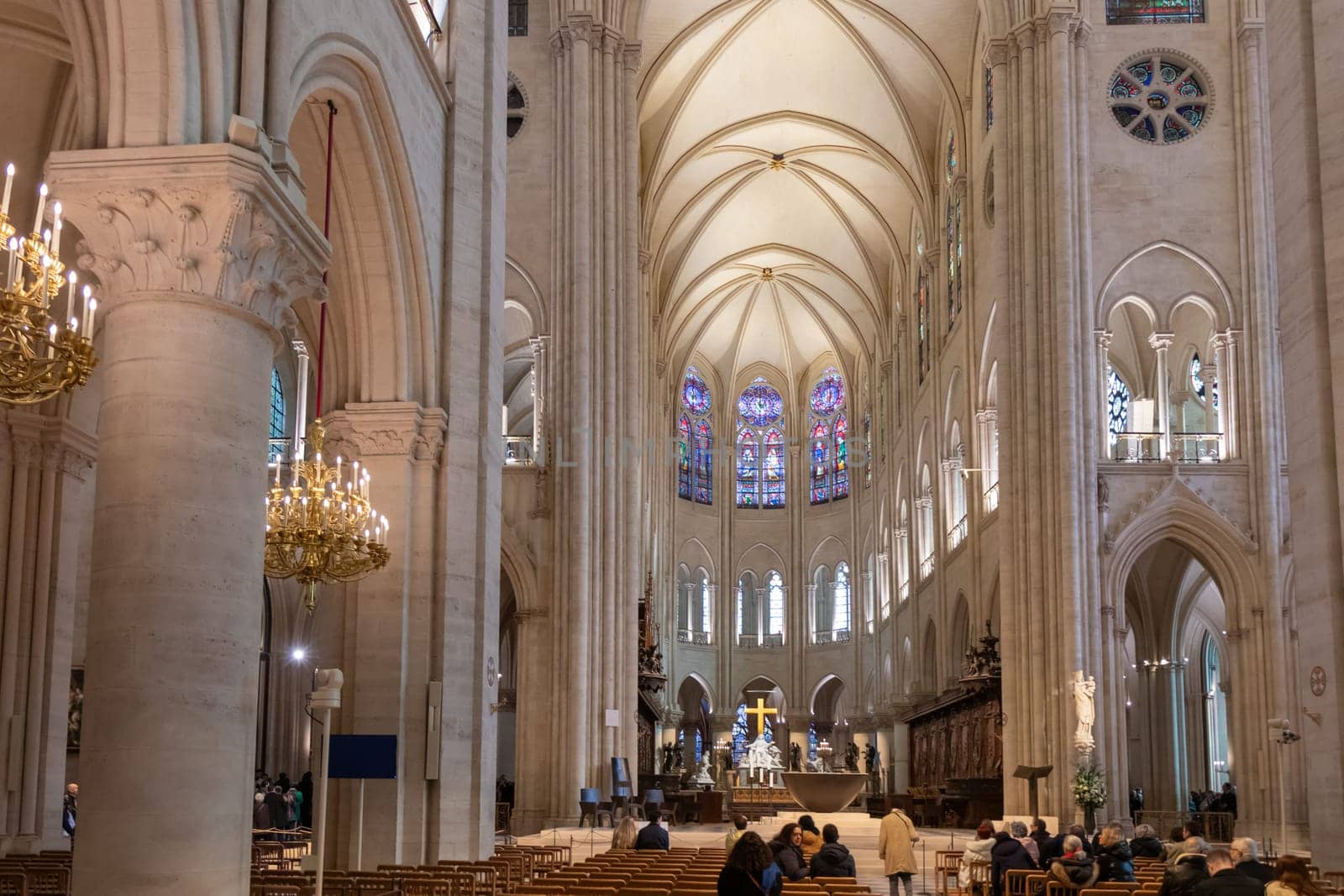 Paris, France - February 22nd 2025 : visitors in The Notre-Dame de Paris, newly re-opened cathedral restored after reconstruction, details of exterior
