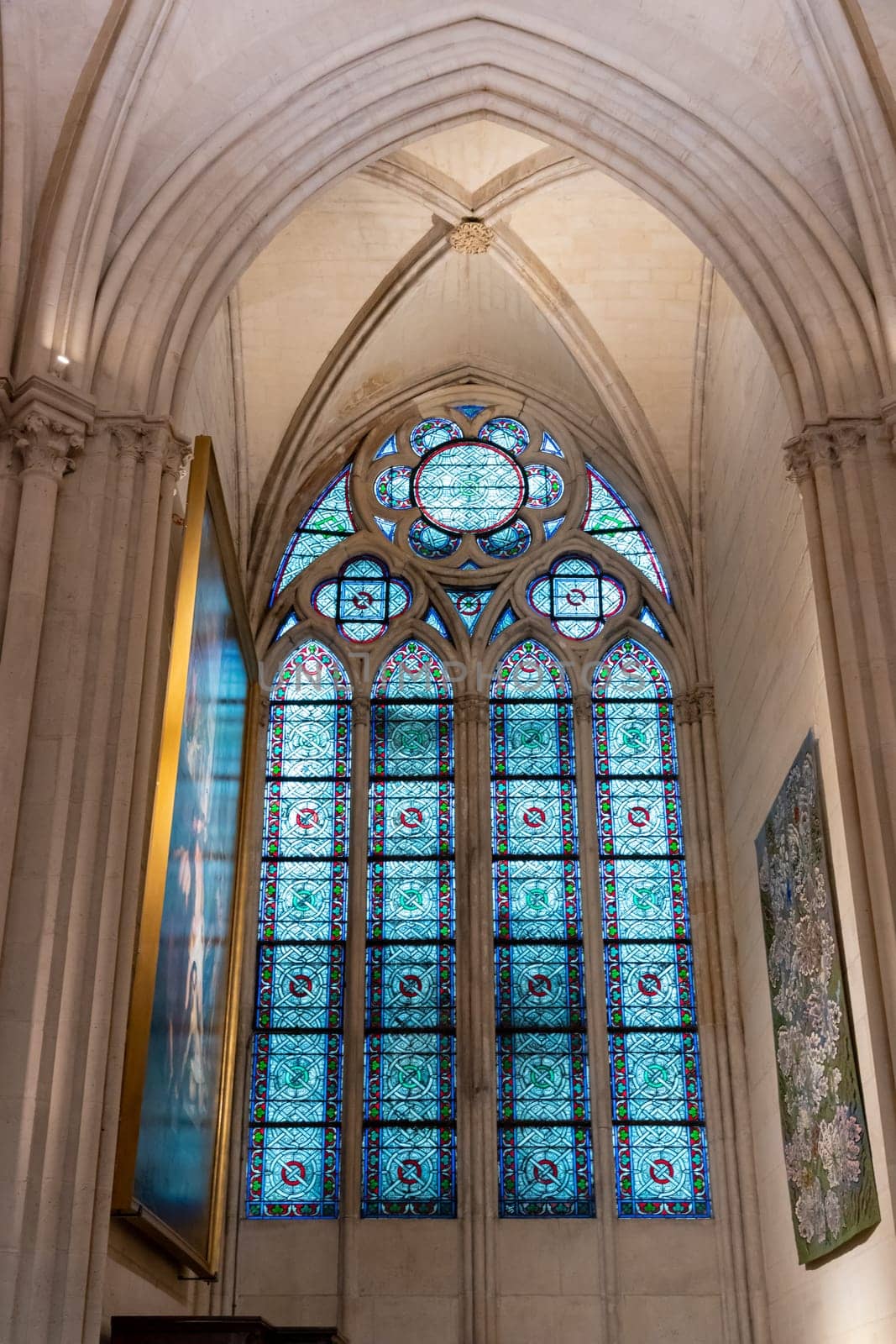 Paris, France - February 22nd 2025 : visitors in The Notre-Dame de Paris, newly re-opened cathedral restored after reconstruction, details of exterior