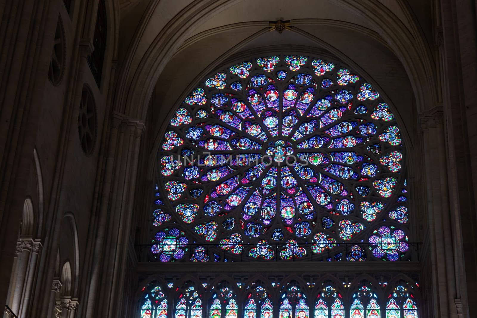 Paris, France - February 22nd 2025 : visitors in The Notre-Dame de Paris, newly re-opened cathedral restored after reconstruction, details of exterior