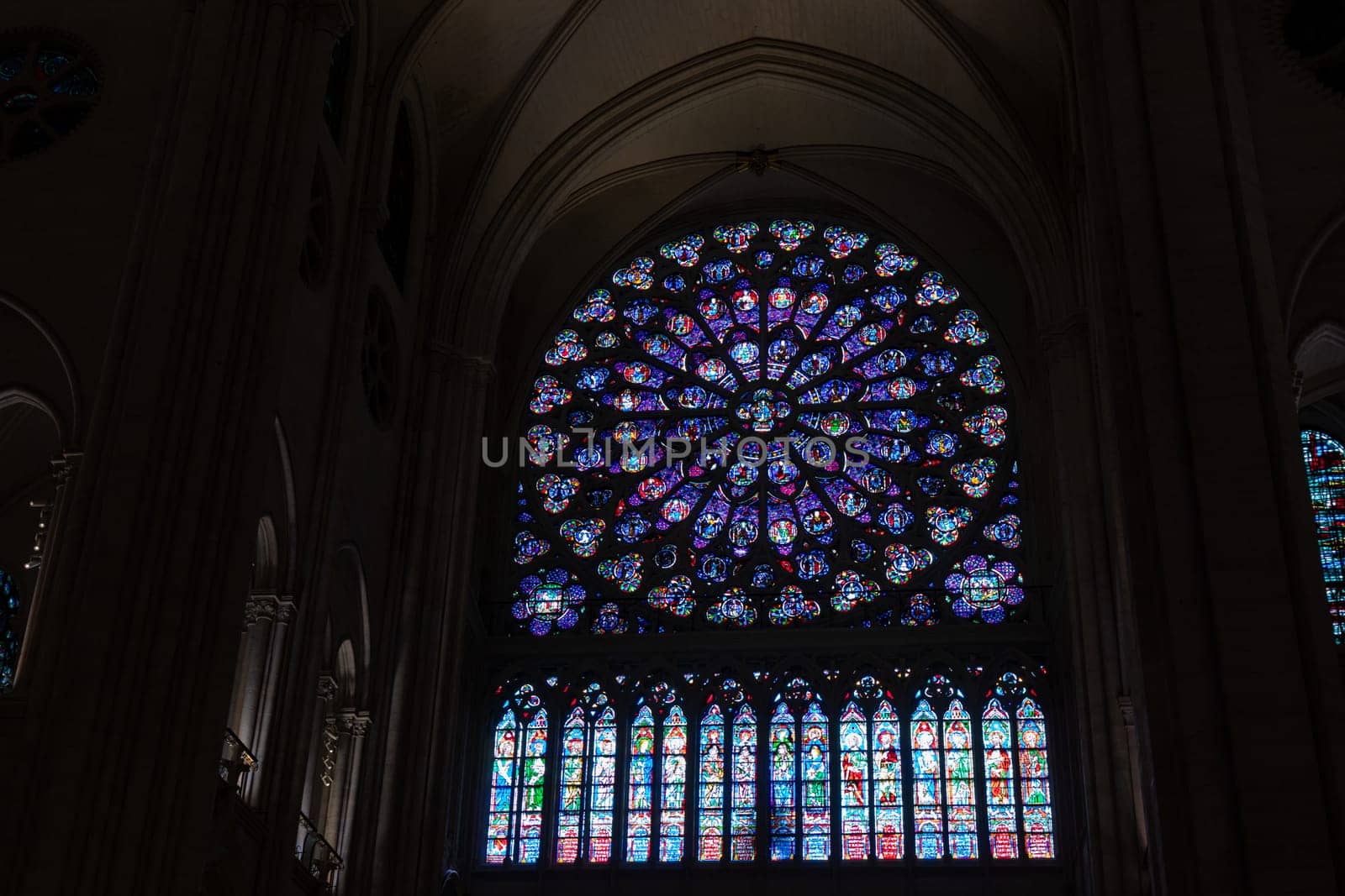 Paris, France - February 22nd 2025 : visitors in The Notre-Dame de Paris, newly re-opened cathedral restored after reconstruction, details of exterior