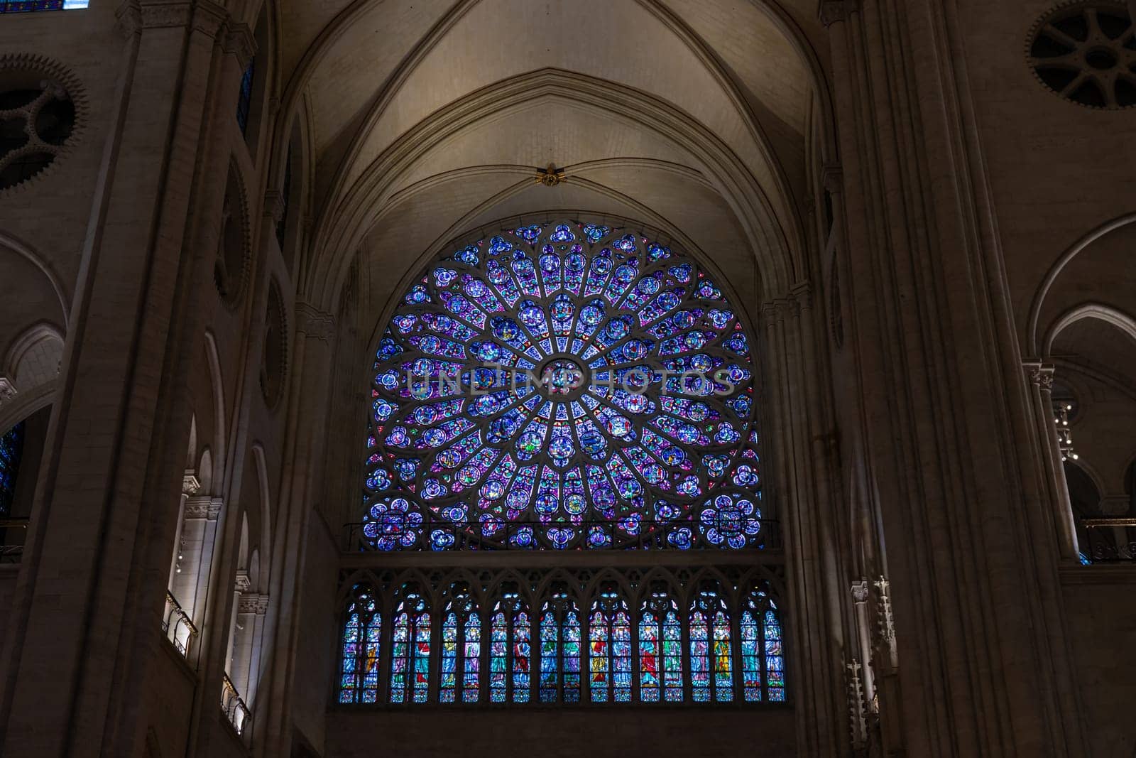 Paris, France - February 22nd 2025 : visitors in The Notre-Dame de Paris, newly re-opened cathedral restored after reconstruction, details of exterior