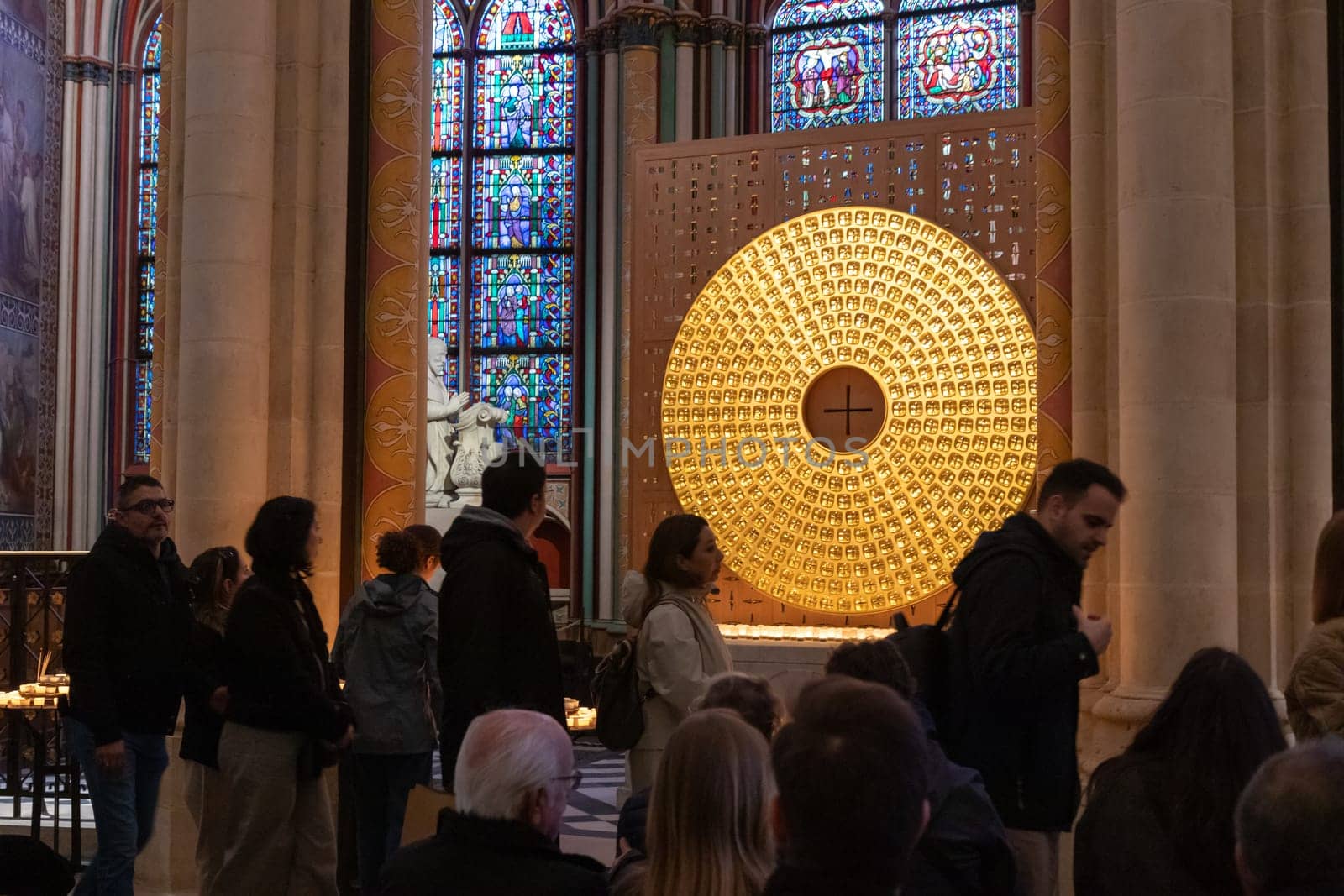 Paris, France - February 22nd 2025 : visitors in The Notre-Dame de Paris, newly re-opened cathedral restored after reconstruction, details of exterior