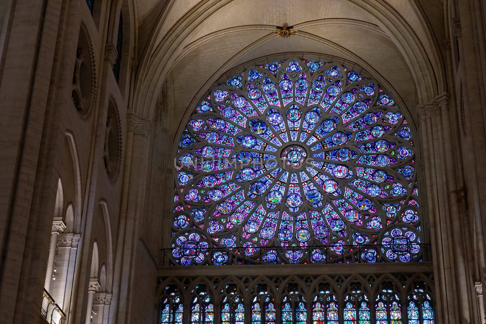 Paris, France - February 22nd 2025 : visitors in The Notre-Dame de Paris, newly re-opened cathedral restored after reconstruction, details of exterior