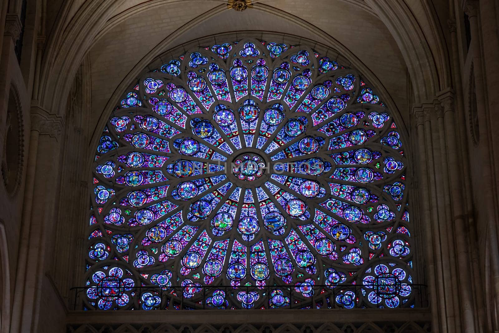 Paris, France - February 22nd 2025 : The Notre-Dame de Paris, newly re-opened cathedral restored after reconstruction, details of exterior, stained glass. UNESCO World Heritage Site