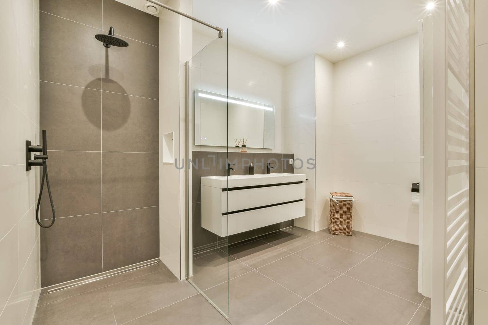 Contemporary bathroom featuring sleek shower area, minimalist fixtures, and stylish cabinetry for a functional and elegant space.
