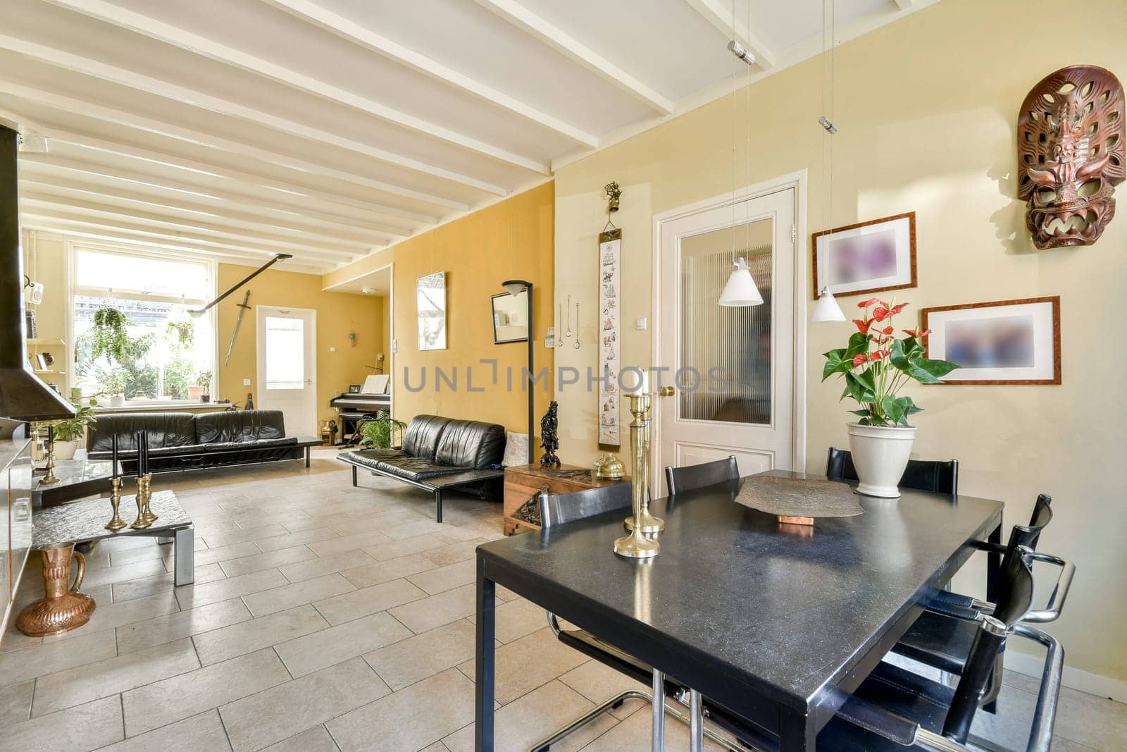 A stylish living space featuring contemporary furniture, elegant decor, and natural light, creating an inviting atmosphere for relaxation and gatherings.