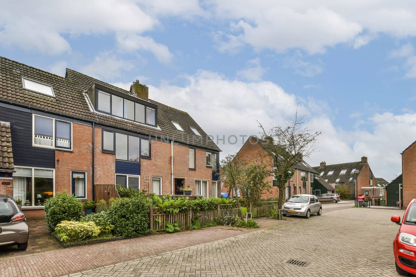 A serene residential area featuring modern architecture, well-maintained gardens, and a peaceful atmosphere. A glimpse of suburban life in a vibrant neighborhood.