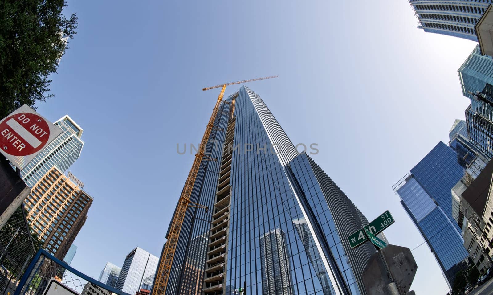 From below fisheye lens view of The Republic building in downtown Austin Texas in spring