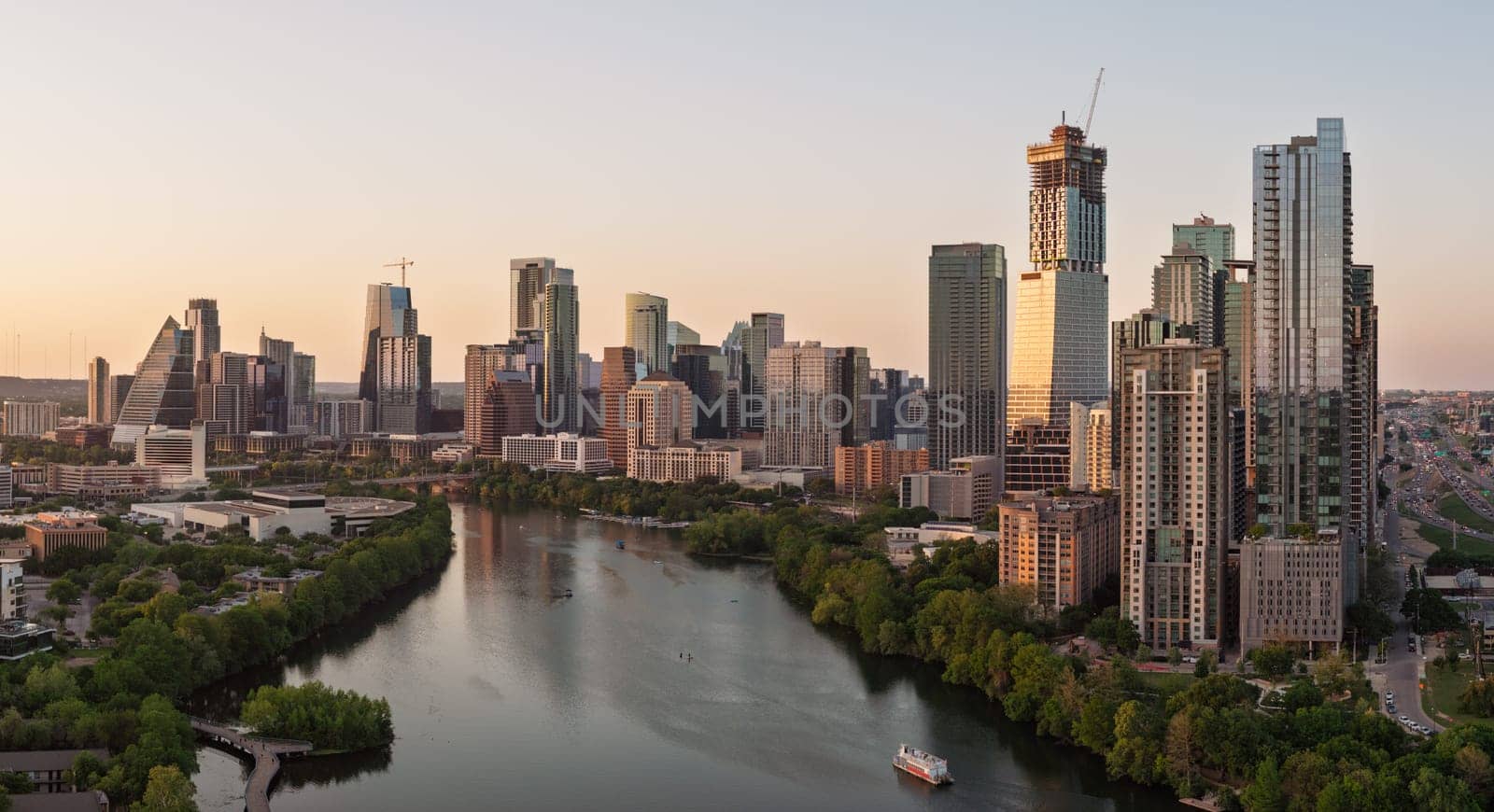 Austin, TX - 10 April 2025: Aerial panoramic skyline of Austin Texas from the east at dusk or sunset