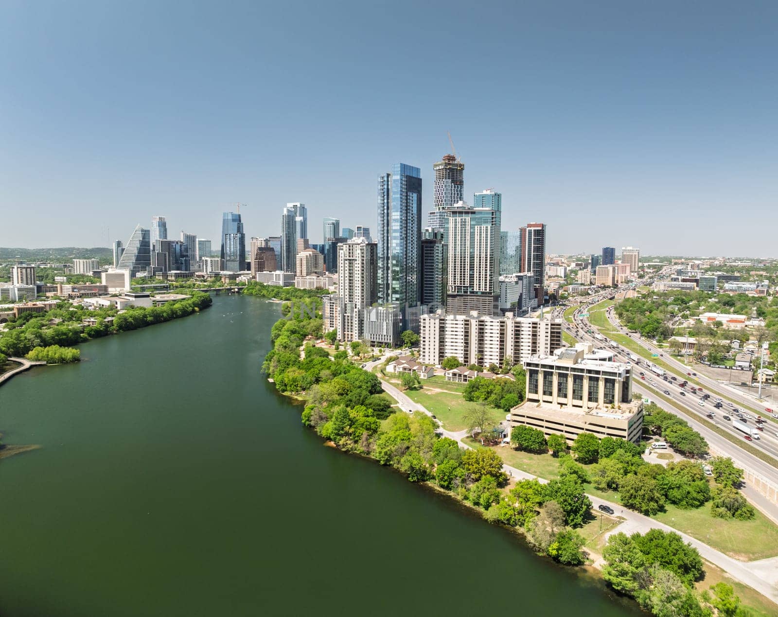 Austin, TX - 10 April 2025: Aerial panoramic skyline of Austin Texas from the east with I35 in foreground