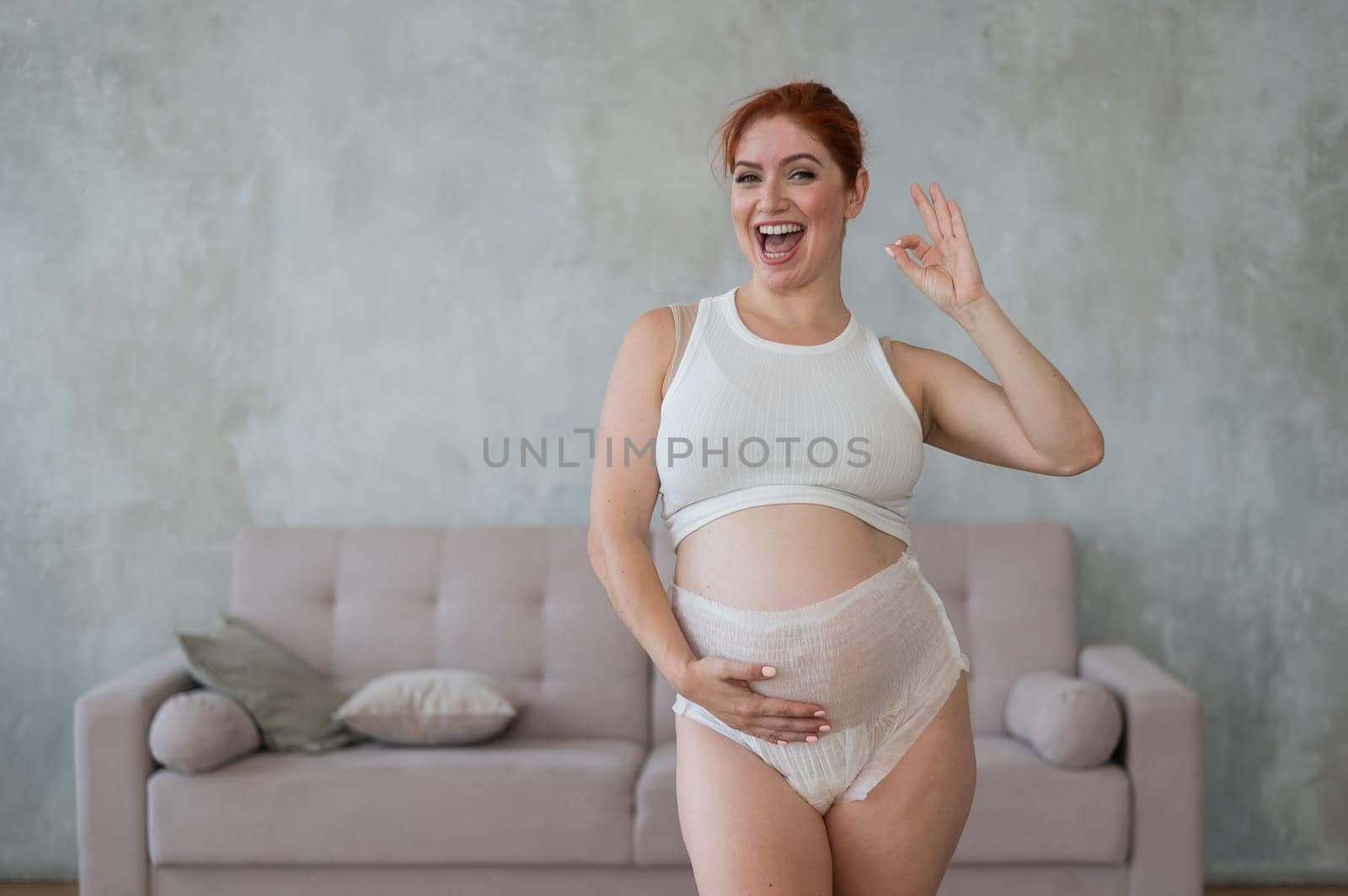 Happy Pregnant Woman Recommends Adult Diapers
