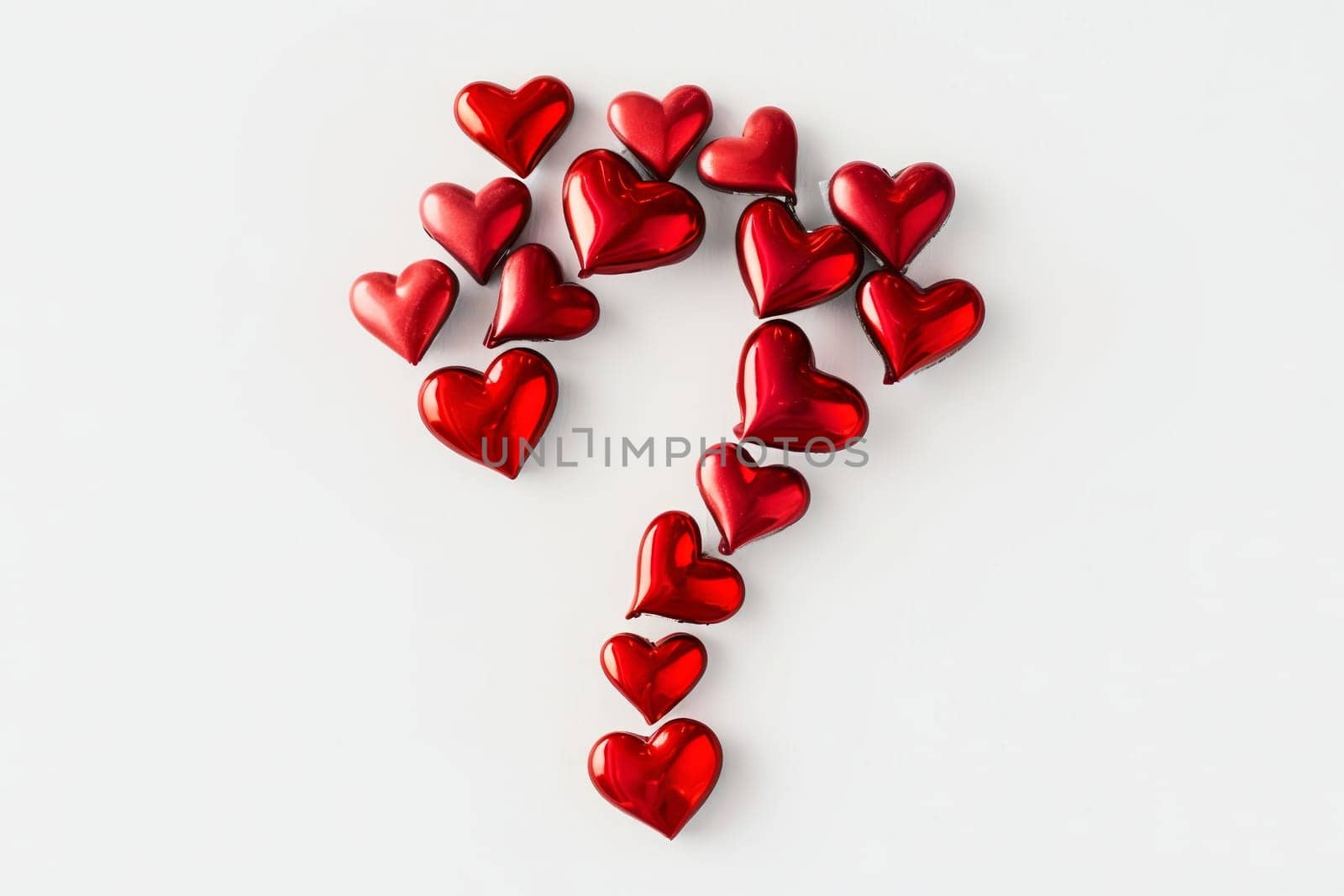 A whimsical composition features numerous shiny red hearts arranged in the shape of a question mark, sparking intrigue and emotion.