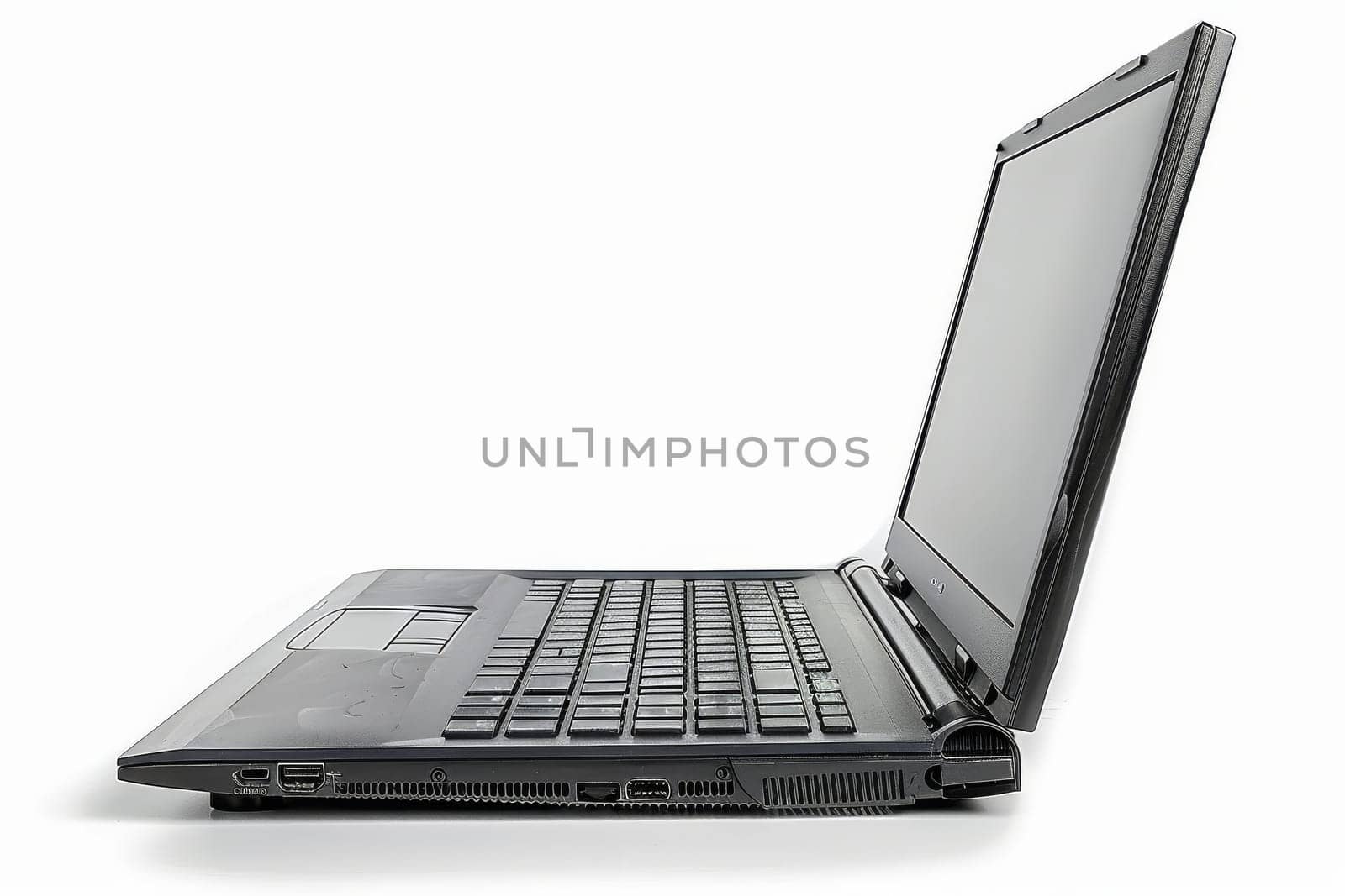 A modern, slim laptop stands open and ready for use against a stark white background, awaiting input.