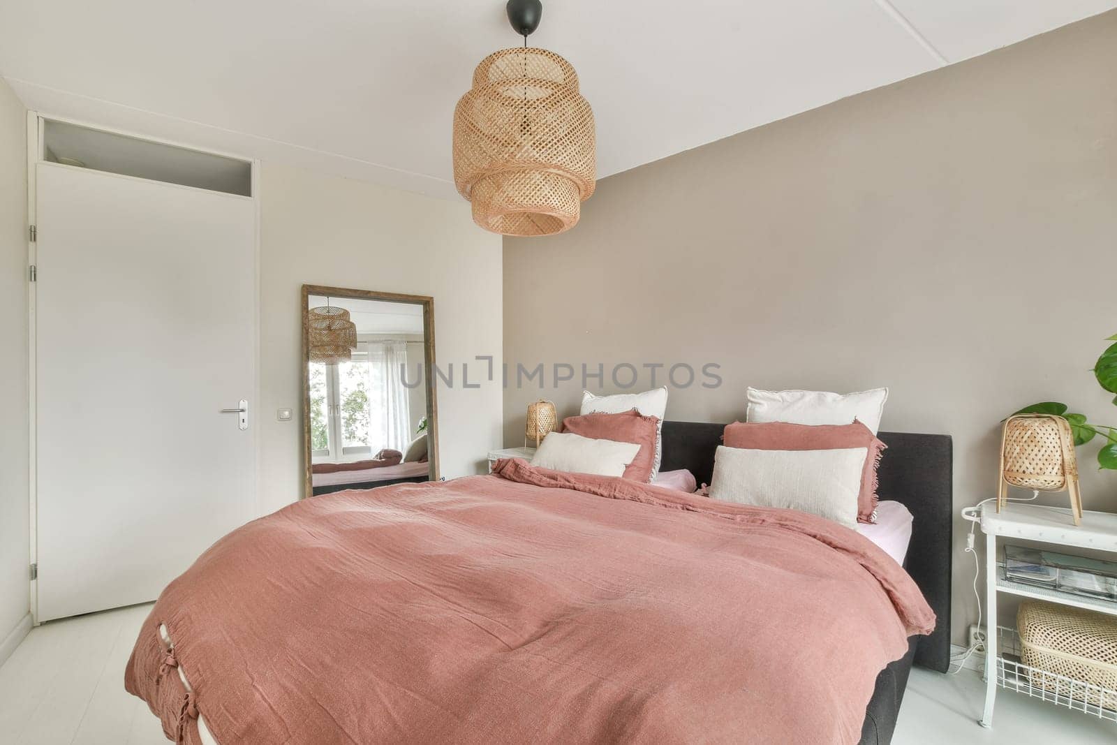 A stylish bedroom featuring modern decor, warm colors, and natural elements, creating a cozy and inviting atmosphere for relaxation or rest.