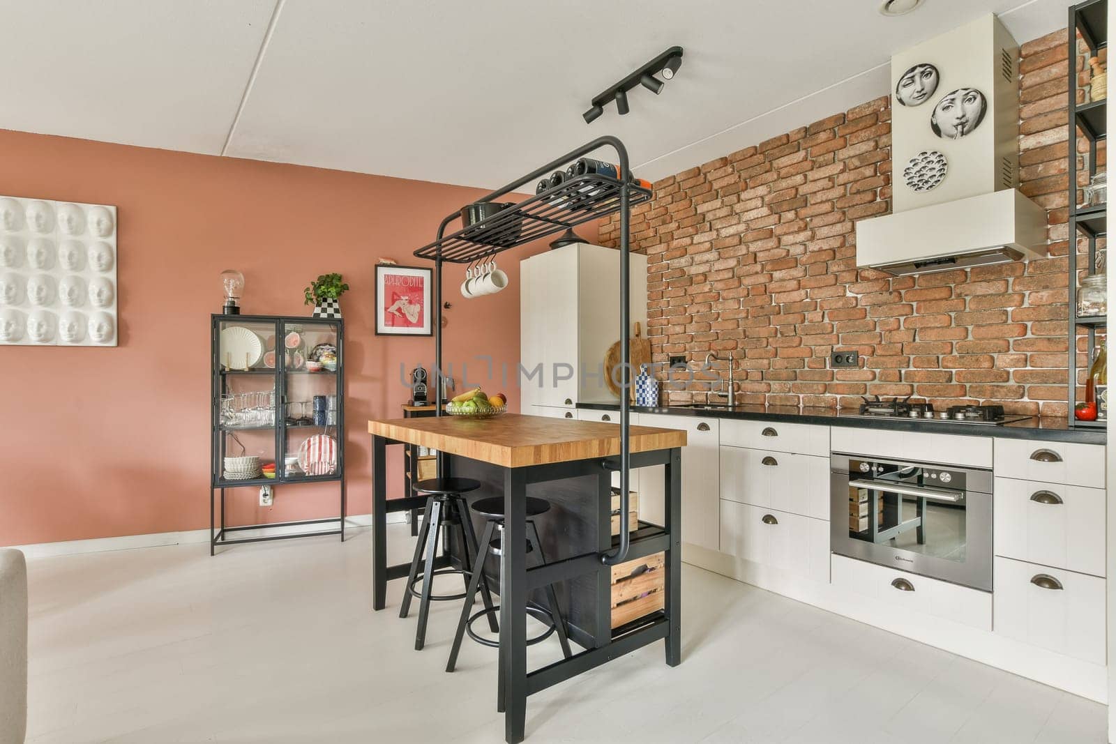 Stylish kitchen featuring a blend of modern and rustic elements, showcasing a brick wall and contemporary fixtures, perfect for culinary enthusiasts.