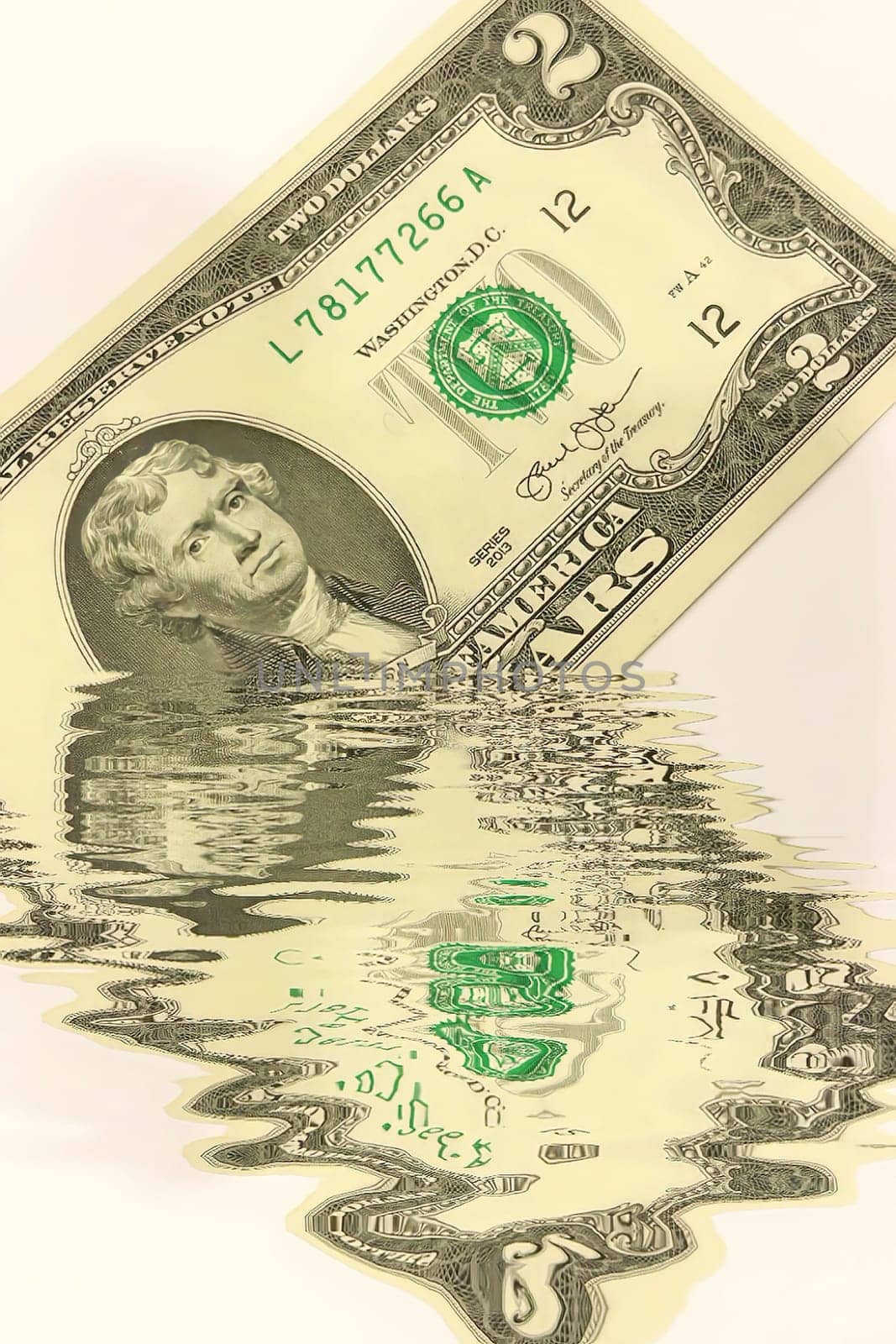 Creative conceptual image of US dollar bills partially submerged in water with a water reflection effect. Symbolizes financial crisis, liquidity problems, or a fluctuating economy. Ideal for articles or graphics related to money, finance, economics, or global markets.