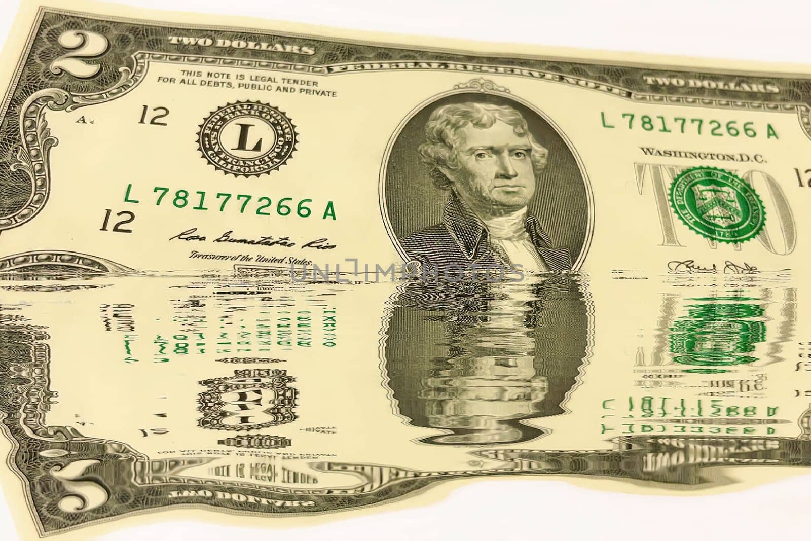 Creative conceptual image of US dollar bills partially submerged in water with a water reflection effect. Symbolizes financial crisis, liquidity problems, or a fluctuating economy. Ideal for articles or graphics related to money, finance, economics, or global markets.
