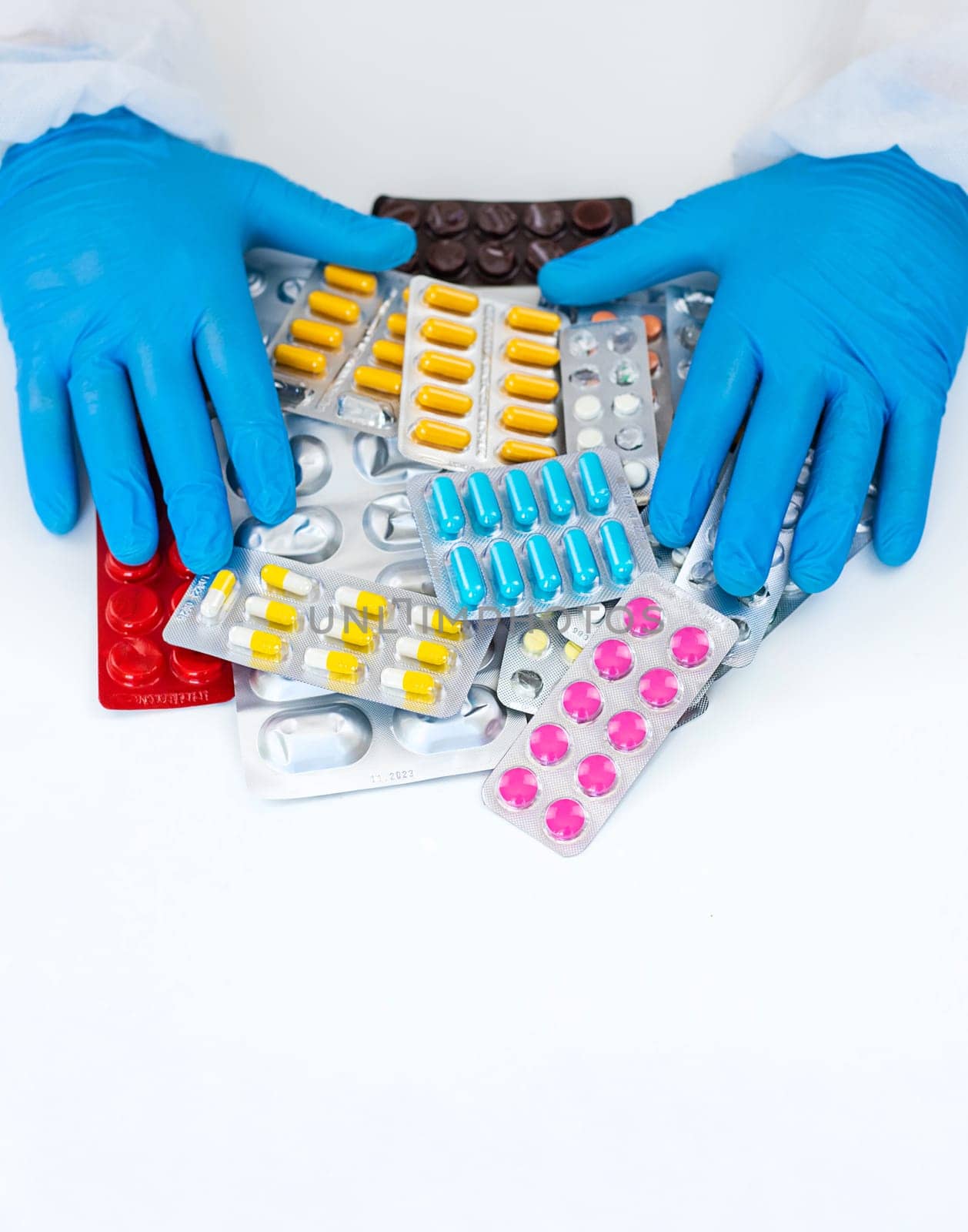 medicines in the hands of a doctor. Selective focus. pills.