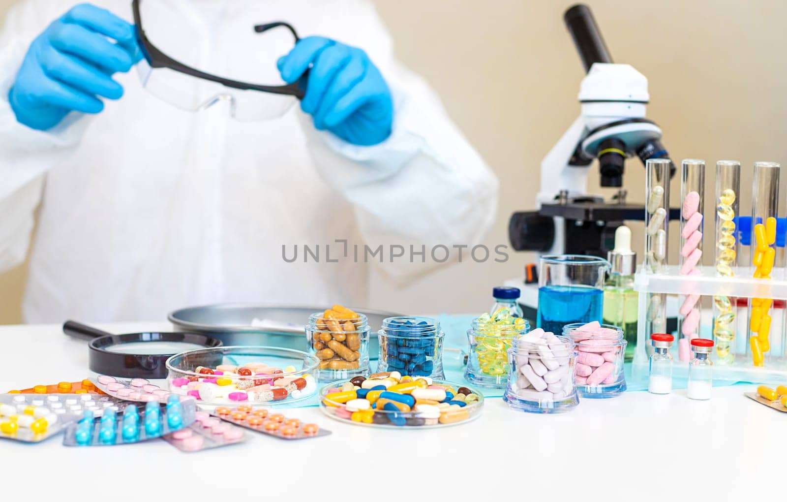 examine drugs in the laboratory. Selective focus. pills.