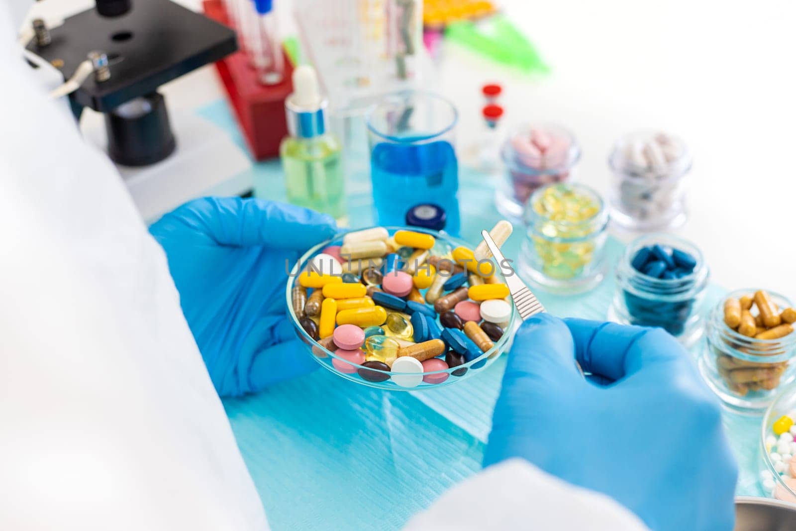examine drugs in the laboratory. Selective focus. pills.