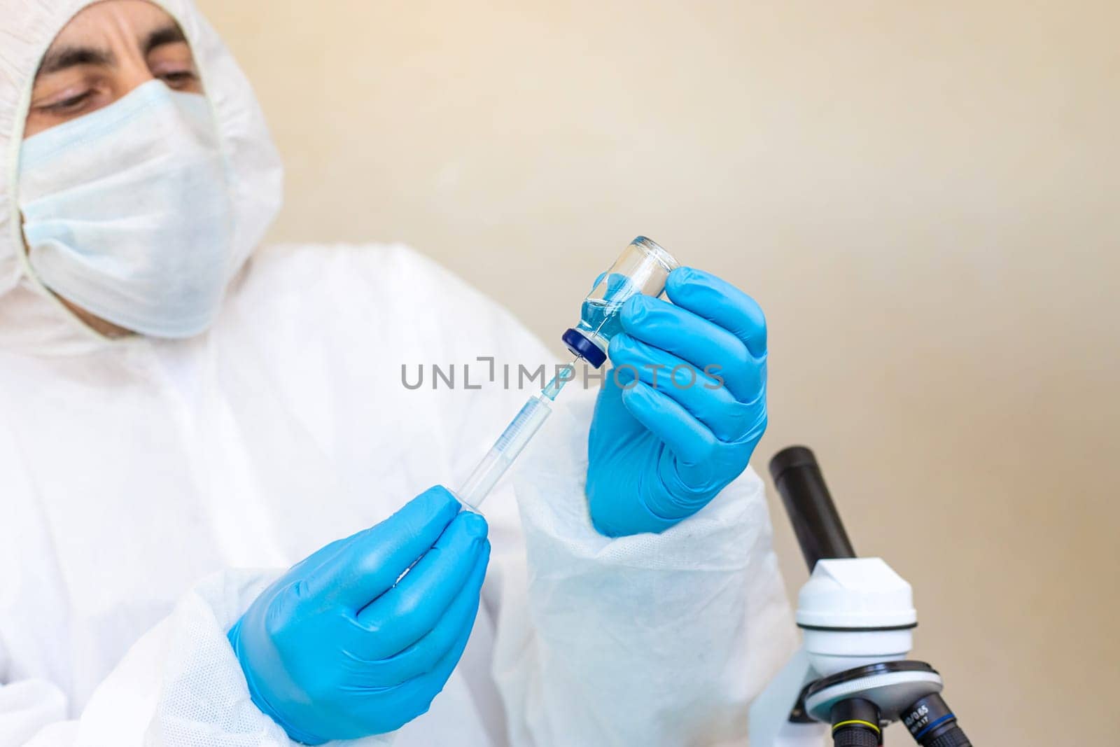 Medicine in a bottle in the hands of a doctor. Selective focus. vaccine