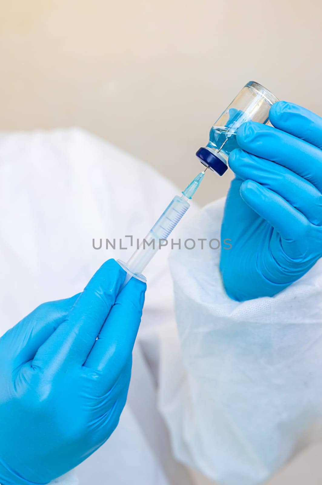 Medicine in a bottle in the hands of a doctor. Selective focus. vaccine