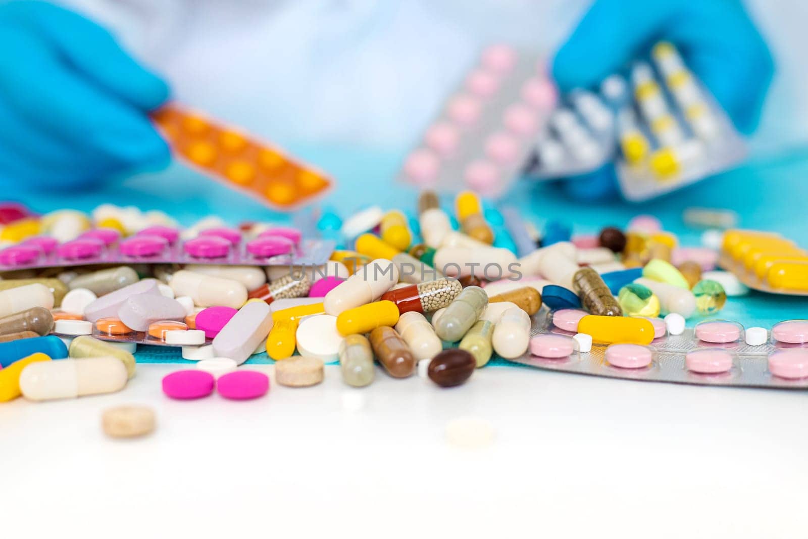 medicines in the hands of a doctor. Selective focus. pills.