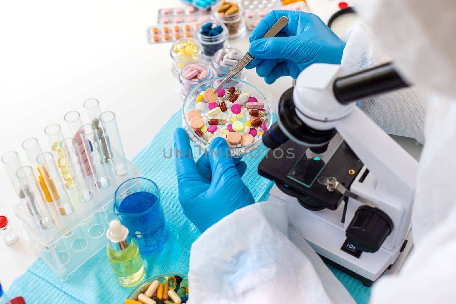 examine drugs in the laboratory. Selective focus. pills.