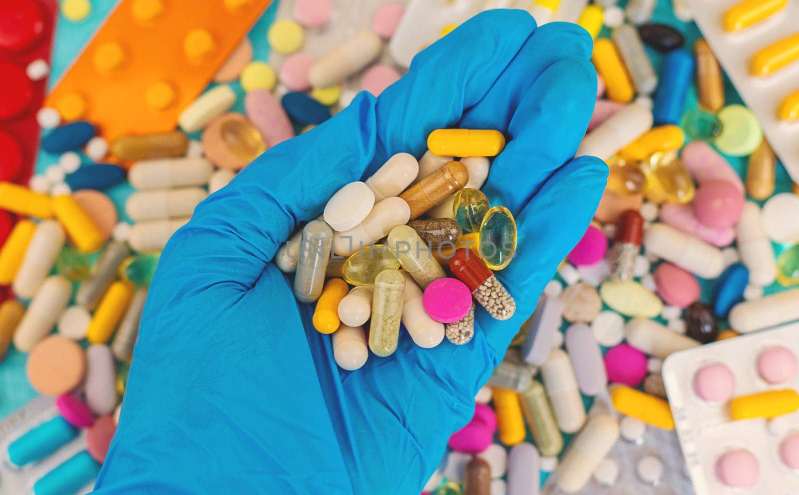 medicines in the hands of a doctor. Selective focus. pills.
