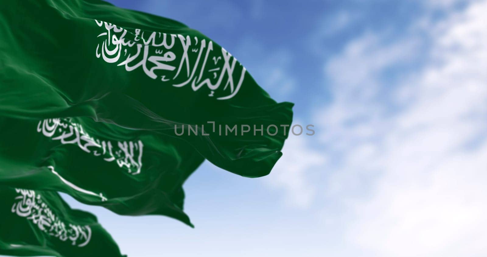 Saudi Arabian flag with Arabic calligraphy waving in the wind. 3D render by rarrarorro