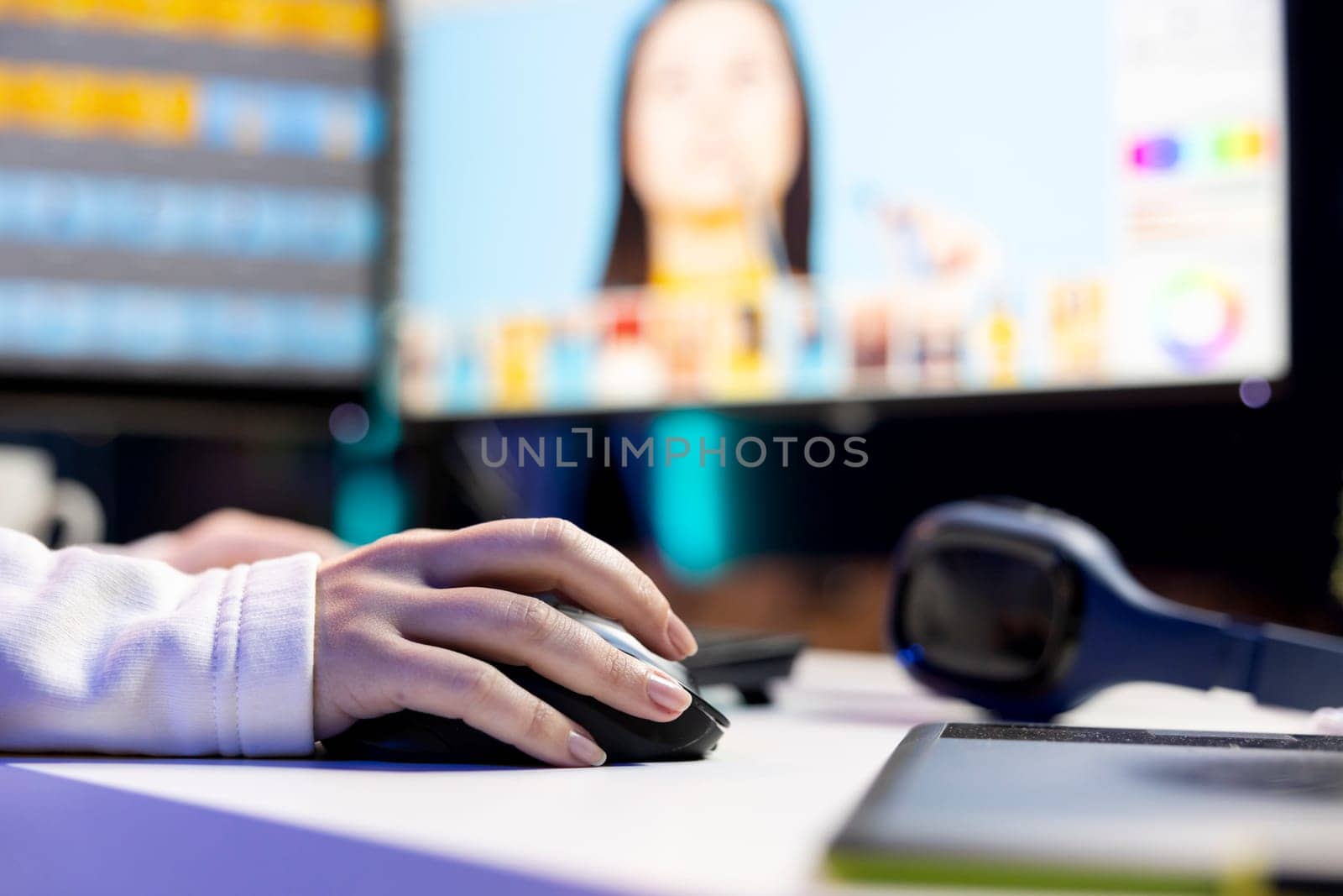 Photo editor color correcting photographs in creative studio using mouse and keyboard, close up shot. Photographer selecting best pictures for editorial content using retouching software